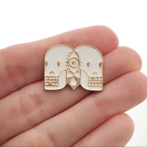 White and Gold Skulls Pin